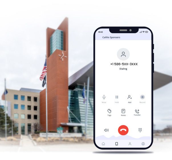A smartphone dialing 586 area code number with Warren Civic Center in background